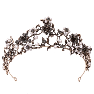 Vintage bronze bridal crown with floral black crystals and white pearls on white background