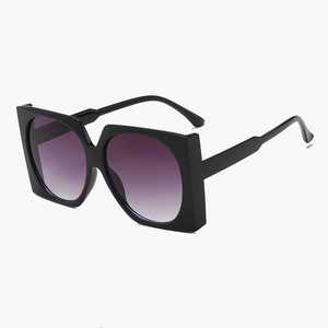 Fashionable oversized square sunglasses with black frame and purple gradient lenses