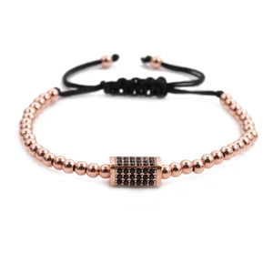 Macro shot of rose gold copper beads bracelet with black cubic zirconia rectangle charm