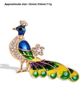 Close-up of vibrant peacock brooch with colorful enamel and sparkling rhinestones