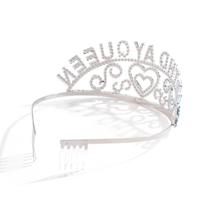 Macro view of silver birthday queen crown with metal hair combs and rhinestone inlay