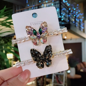 Elegant set of two butterfly hair clips with colorful and black zircons on gold metal pins