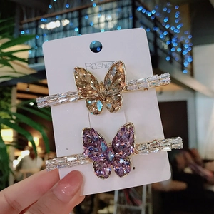 Elegant crystal butterfly hair clips in champagne and purple set of two with gold plating