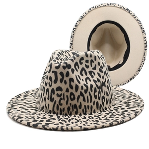 Detail of wide brim leopard print fedora hat showing inner black sweatband and label