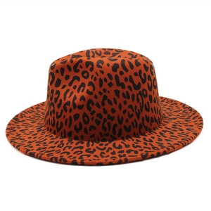 Detail view of the orange leopard print fedora hat with flat top and wide brim texture