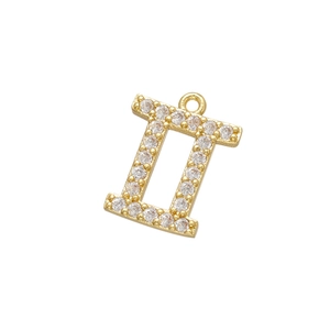 Détail macro du pendentif zodiaque Gémeaux doré avec pierres de zircone incrustées