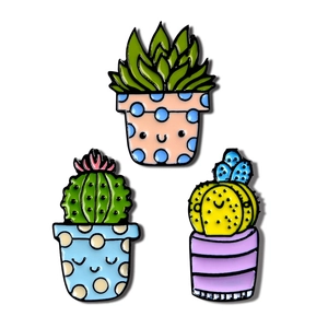 Three cute cactus enamel pins in colorful pots for denim jackets and creative fashion accessory
