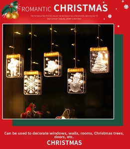 Close-up of 3D Christmas LED window lights featuring Santa and snowflake acrylic pendants