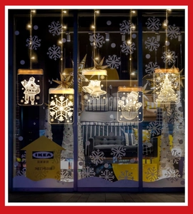 Detail of five 3D acrylic Christmas LED window lights showing Santa and tree designs