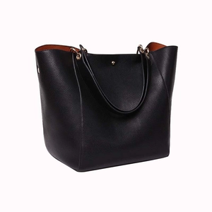 Black large-capacity leather tote bag with orange lining and minimalist handle design