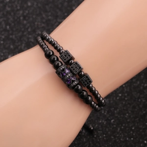 Black beaded stretch bracelet set with cubic zirconia heart and square cube charms