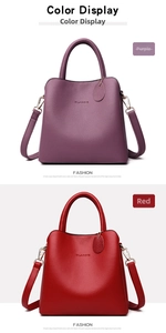Detail of lychee pattern leather bucket bags in purple and red with classic embossed text