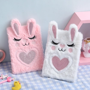 Detail of plush cartoon notebooks with 3D ears, sequined hearts and fluffy textures