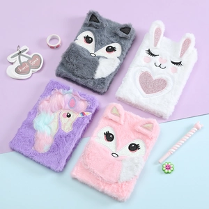 Flat lay of colorful plush animal notebooks including fox, rabbit, and unicorn designs