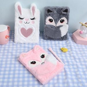 Detailed view of plush animal journals with cute embroidery and sequin decorations
