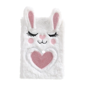 Close-up of white plush bunny notebook cover with pink glitter heart and soft texture