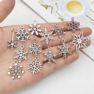 Set of twelve silver Tibetan snowflake charms for DIY jewelry and beaded bracelets