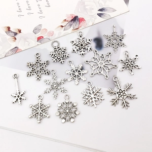 Set of 13 unique silver snowflake charms in various styles for DIY jewelry making