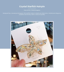 Macro shot of sparkling crystal starfish hair clip with gold-plated base on display card