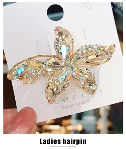 Macro detail of a starfish hair clip with sparkling K9 crystal rhinestones and gold base
