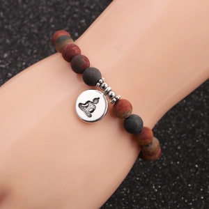 8mm natural agate beaded bracelet with silver Buddha charm on display stand