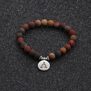 Macro shot of 8mm multicolor natural stone beads bracelet with silver Buddha pendant