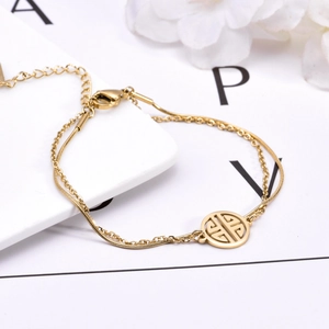 Double-layered gold plated stainless steel bracelet with a round auspicious charm pendant