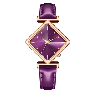 Detailed close-up of a purple leather strap watch with a rose gold rhombic dial