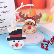 Christmas wooden reindeer and snowman pendants with hanging ropes for holiday tree decoration