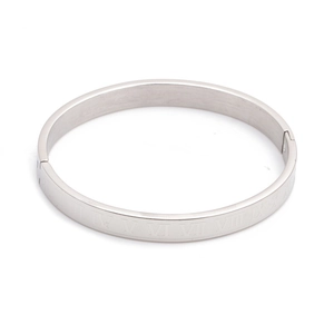 Detail of silver stainless steel bangle with roman numeral engraving and clasp buckle