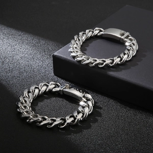 Classic silver stainless steel Cuban link bracelet with professional black display background