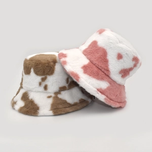 Winter plush bucket hats with brown and pink cow print patterns for fashion warmth