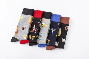 Detail of five pairs of men's cotton socks with whiskey and beer bottle patterns