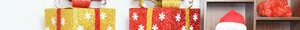 Detail of red and gold Christmas gift boxes with glitter snowflakes and festive ribbon bows