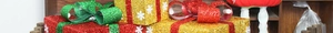 Close-up of glittering Christmas gift boxes with snowflake patterns and shiny ribbons