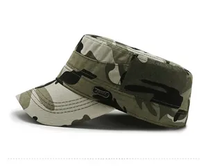 Detail of camouflage military flat top hat with metal Sport badge and stitched brim