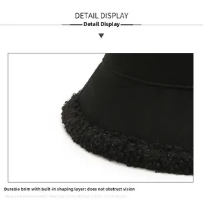 Detail of black winter bucket hat showing warm fleece texture and shaped brim design