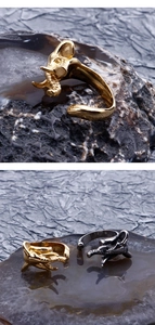 Macro shot of punk elephant ring with detailed trunk texture in gold and silver finish