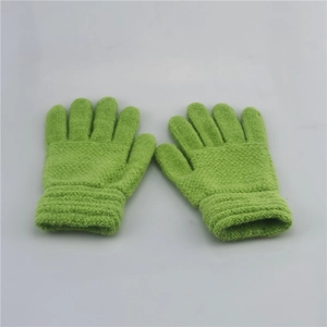 Detailed view of green knitted winter gloves for kids featuring a soft wool texture