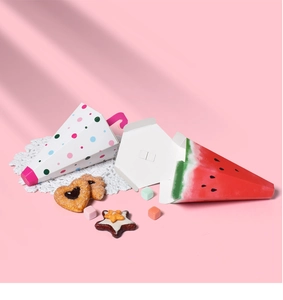 Detail of umbrella-shaped gift boxes featuring polka dot and watermelon designs