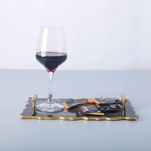 Rectangle resin tray with black marble pattern, gold edges, and metal handles