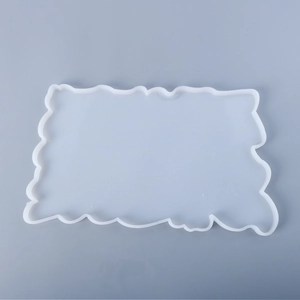 Macro shot of flexible white translucent silicone mold with wavy edges for resin DIY