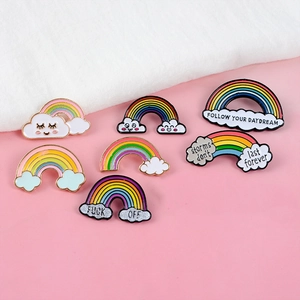Creative enamel rainbow and cloud pin set with various colorful cartoon designs