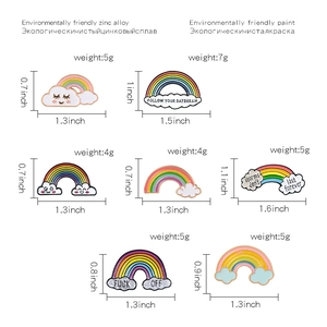 Detail view of rainbow enamel pins set with precise weight and size measurements