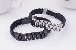 Detail of woven leather bracelets with stainless steel watchband-style metal buckles