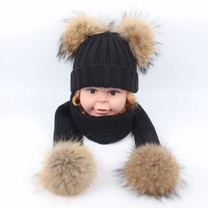 Winter knit baby hat and scarf set featuring large faux fur double pom-poms in black