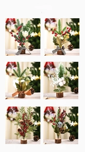 Mini Christmas tree detail with red berries, pine cones and cotton on wooden base