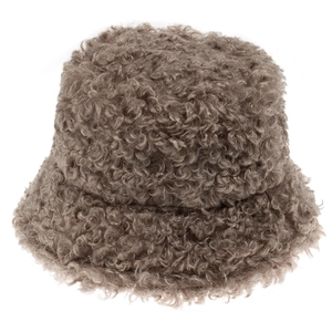 Close-up of beige fuzzy lamb wool bucket hat showcasing soft plush texture and warm material