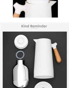 Detailed view of insulated kettle with glass liner, wooden handle, and white matte shell