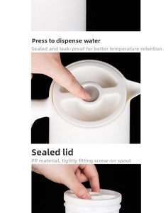 Detail of white thermal carafe with push-button lid and leak-proof screw mouth